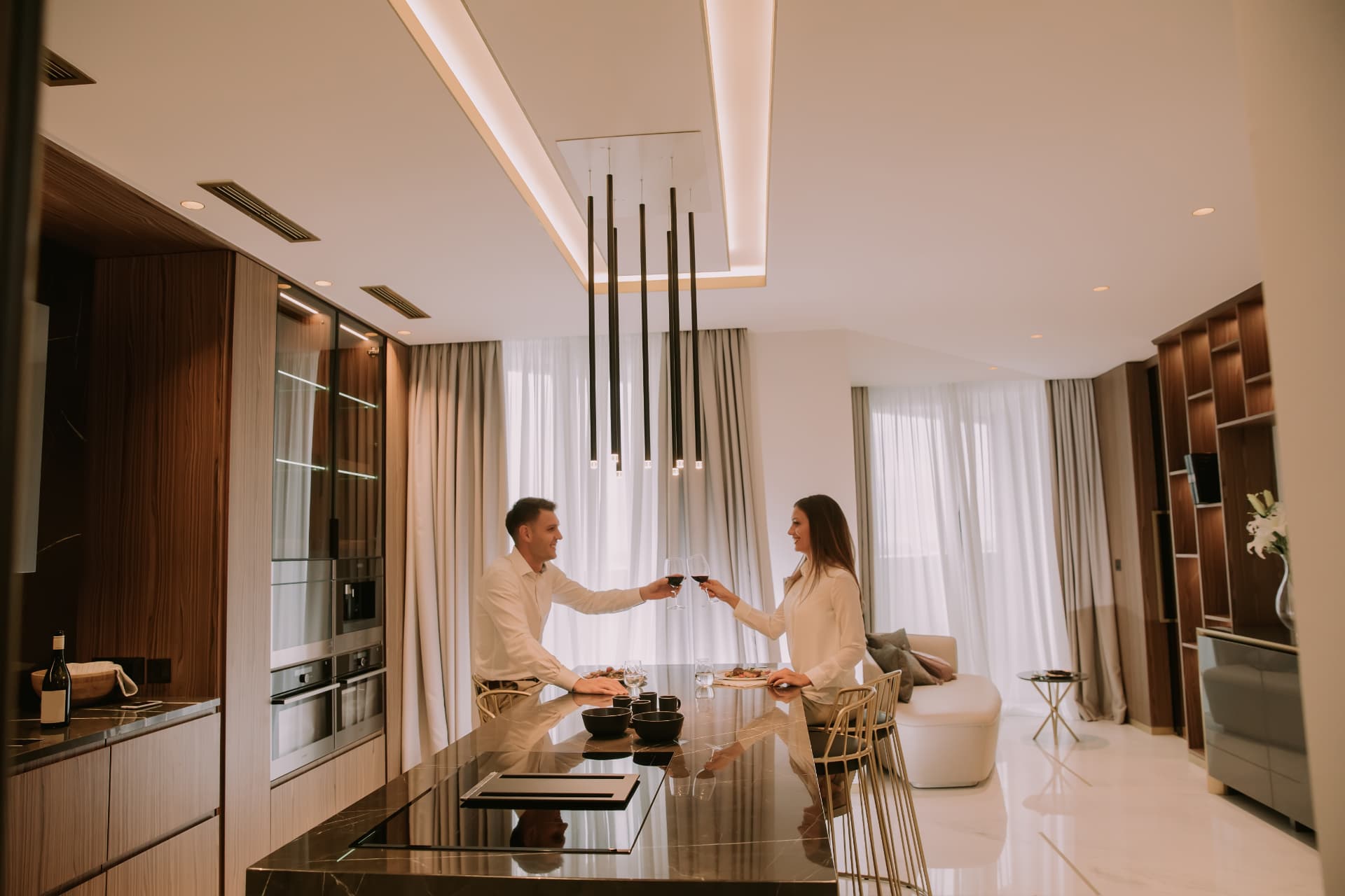 Guests dining inside a modern vacation rental