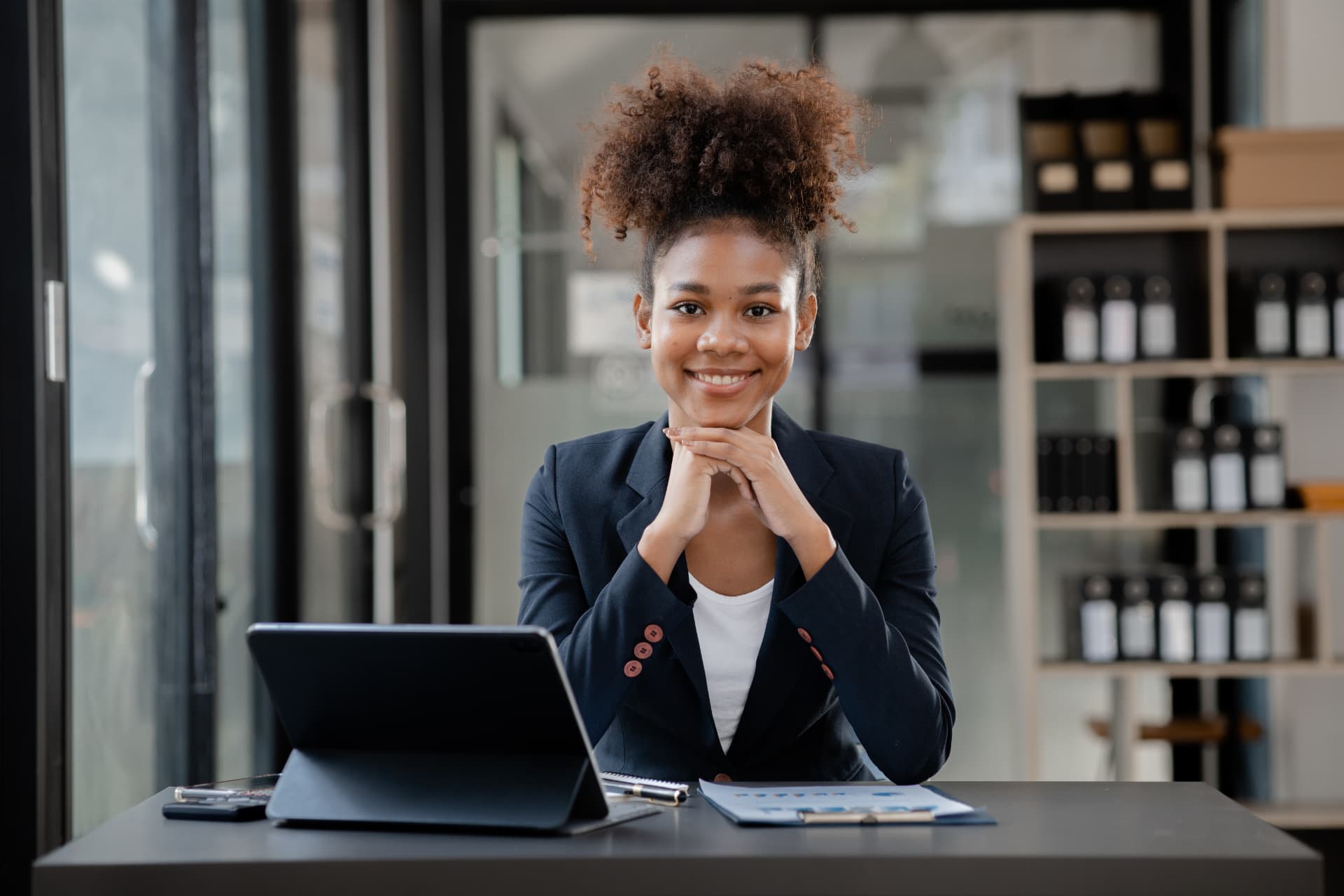 Professional candidate smiling at her desk