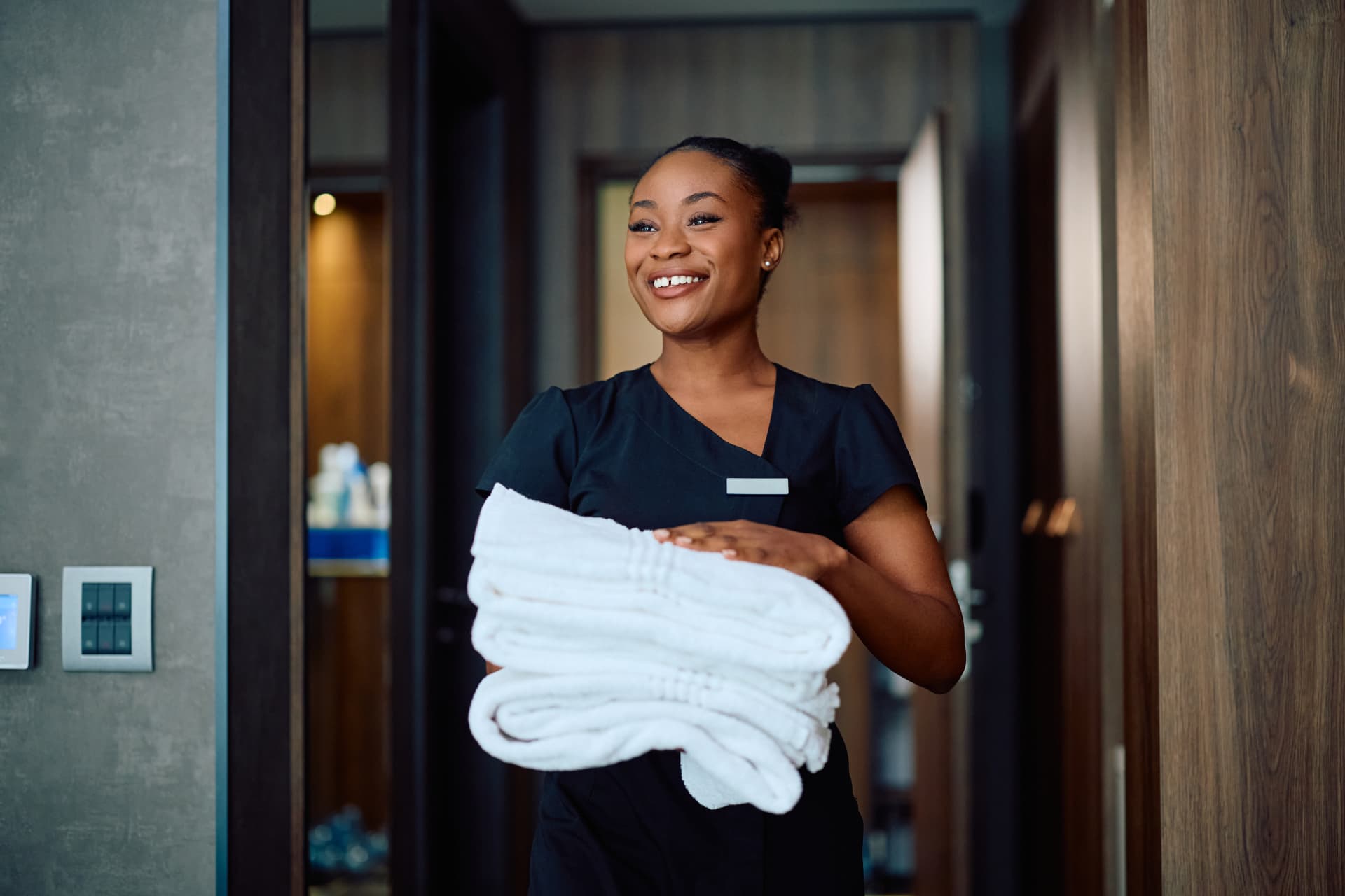 Housekeeper preparing a hotel room